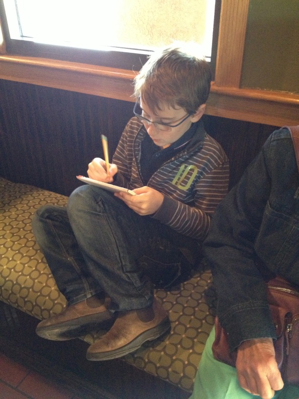 Matthias Drawing at a Restaurant